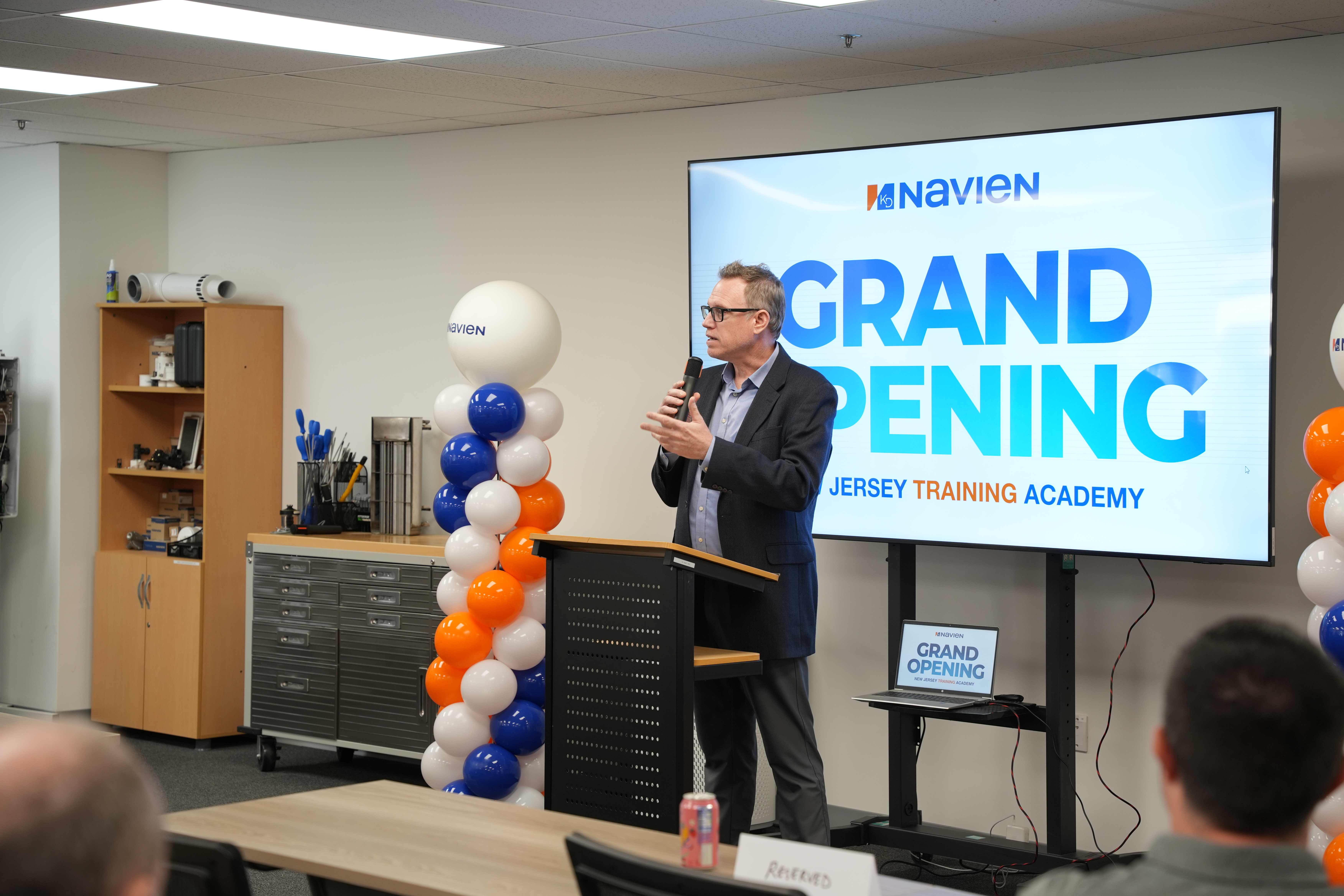 Attendees gather as opening remarks are delivered during the grand opening of Navien's New Jersey Training Academy